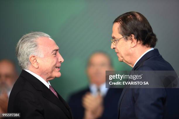 Brazilian President Michel Temer speaks with his new Labour Minister Caio Vieira de Mello during his inauguration ceremony at the Planalto Palace in...