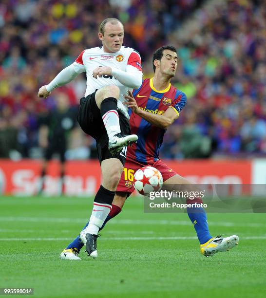 Sergio Busquets of FC Barcelona and Wayne Rooney of Manchester United in action during the UEFA Champions League final between FC Barcelona and...