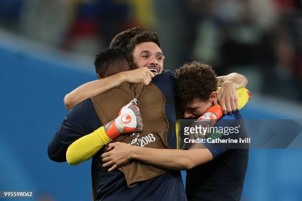 Hugo Lloris of France celebrates victory with Benjamin Pavard and Steve Mandanda following the 2018 FIFA World Cup Russia Semi Final match between...