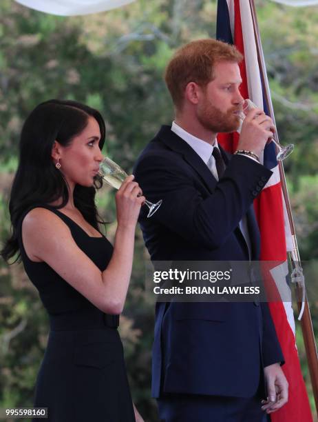 Britain's Prince Harry and wife Meghan, the Duke and Duchess of Sussex attend a Summer Party at the British Ambassador's residence at Glencairn House...