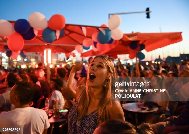 France's supporters celebrate after victory in Marseille on July 10 in the Russia 2018 World Cup semi-final football match between France and Belgium...