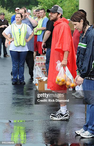 During lightening, hail and flash flood warnings Actor Luke Perry, part time Middle Tennessee resident volunteers with Soles4souls Inc.to bring...