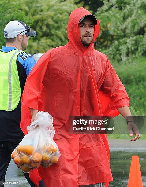 During lightening, hail and flash flood warnings Actor Luke Perry, part time Middle Tennessee resident volunteers with Soles4souls Inc.to bring...