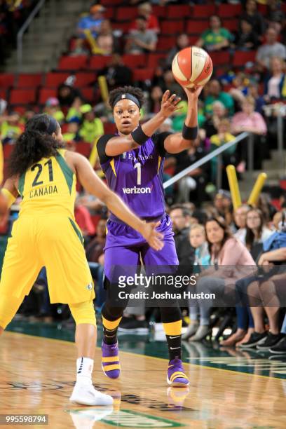 Odyssey Sims of the Los Angeles Sparks passes the ball against the Seattle Storm on July 10, 2018 at Key Arena in Seattle, Washington. NOTE TO USER:...