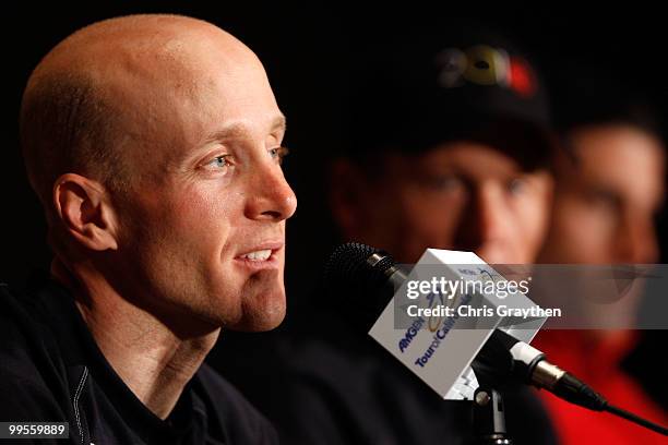 Levi Leipheimer speaks as teammate Lance Armstrong of Team Radio Shack listens with George Hincapie of BMC Racing during a during a press conference...