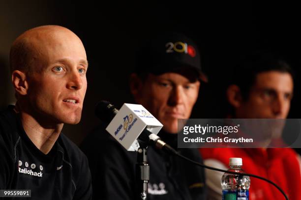 Levi Leipheimer speaks as teammate Lance Armstrong of Team Radio Shack listens with George Hincapie of BMC Racing during a during a press conference...