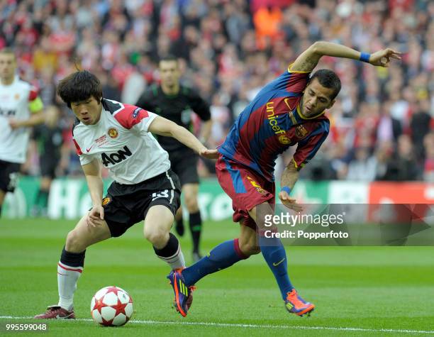 Daniel Alves of FC Barcelona and Wayne Rooney of Manchester United in action during the UEFA Champions League final between FC Barcelona and...