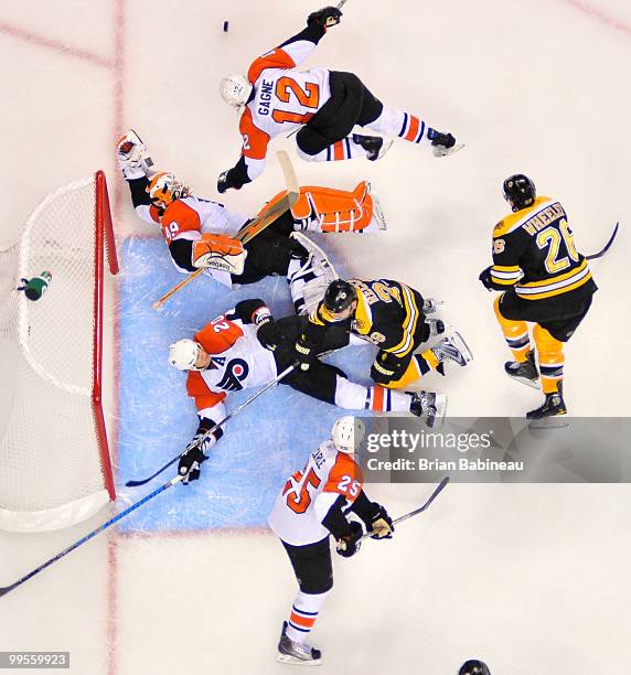 Simon Gagne of the Philadelphia Flyers skates after the loose puck against the Boston Bruins in Game Seven of the Eastern Conference Semifinals...