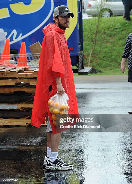 During lightening, hail and flash flood warnings Actor Luke Perry, part time Middle Tennessee resident volunteers with Soles4souls Inc.to bring...