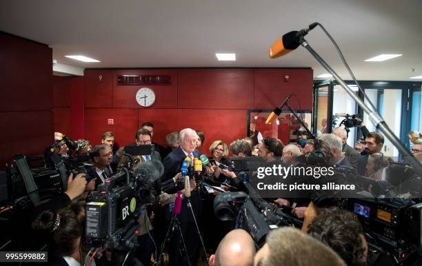 Bavarian Prime Minister Horst Seehofer speaks to media after a CSU parliamentary group meeting at the Bavarian state parliament in Munich, Germany,...