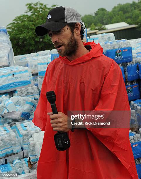 During lightening, hail and flash flood warnings Actor Luke Perry, part time Middle Tennessee resident volunteers with Soles4souls Inc.to bring...