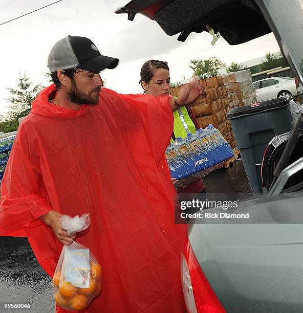 During lightening, hail and flash flood warnings Actor Luke Perry, part time Middle Tennessee resident volunteers with Soles4souls Inc.to bring...