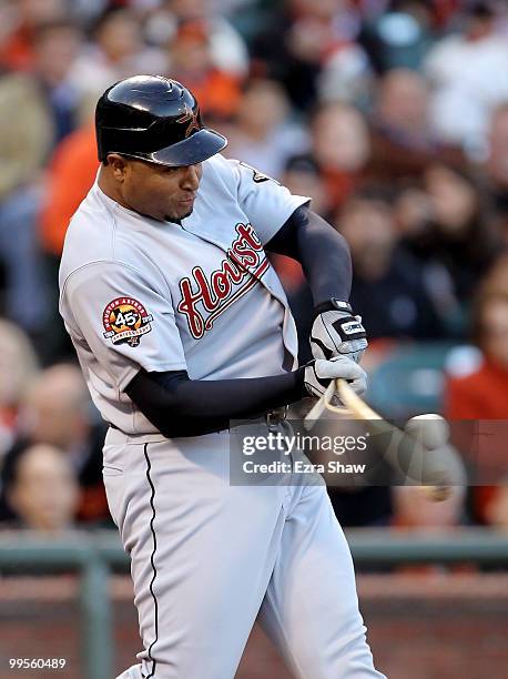 Carlos Lee of the Houston Astros breaks his bat on a foul ball during their game against the San Francisco Giants at AT&T Park on May 14, 2010 in San...