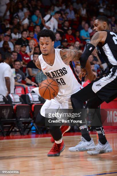 McDaniels of the Portland Trail Blazers handles the ball against the San Antonio Spurs during the 2018 Las Vegas Summer League on July 10, 2018 at...