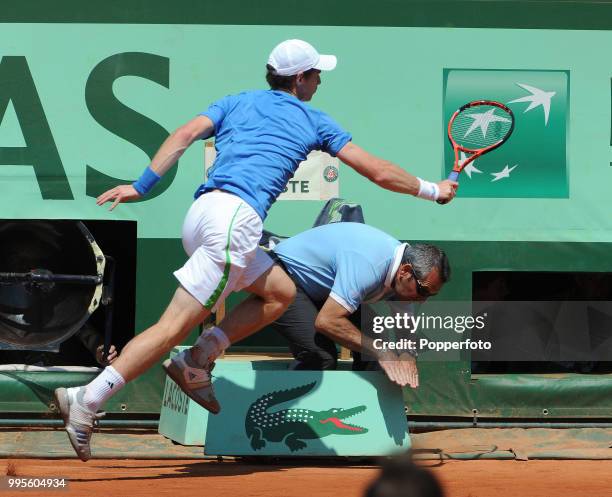 Andy Murray of Great Britain makes a line judge take evasive action during the men's semi-final against Rafael Nadal of Spain on day 13 of the French...