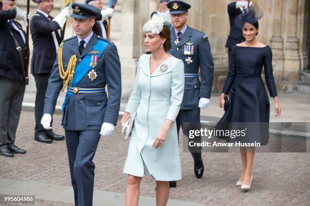 Prince William, Duke of Cambridge, Catherine, Duchess of Cambridge, Prince Harry, Duke of Sussex and Meghan, Duchess of Sussex, wearing a dark navy...
