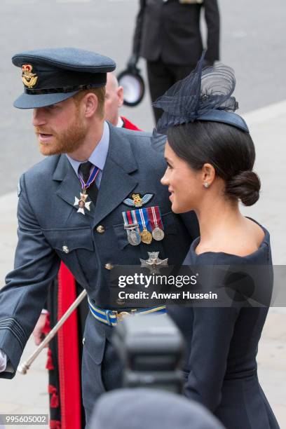 Prince Harry, Duke of Sussex and Meghan, Duchess of Sussex, wearing a dark navy Dior dress and a hat by milliner Stephen Jones, attend a service at...