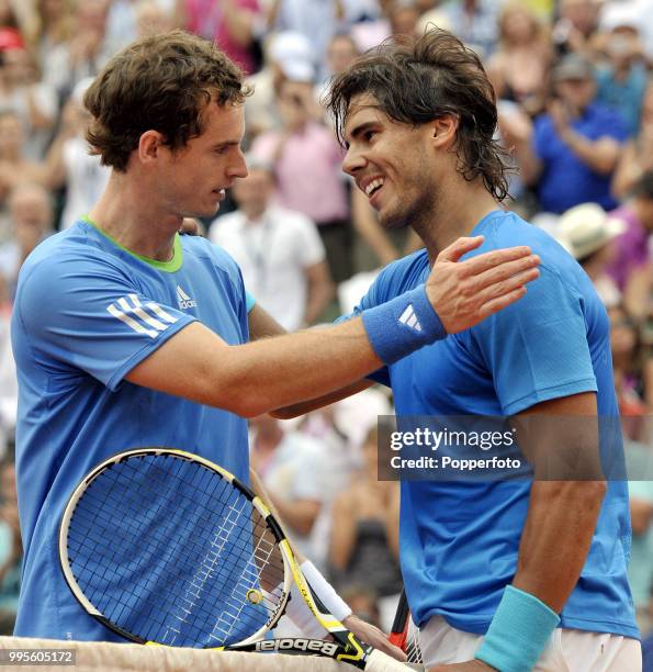 Rafael Nadal of Spain is congratulated by Andy Murray of Great Britain after Nadal's straight-sets victory following their semi-final match during...