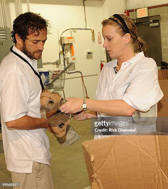 Actor Luke Perry, part time Middle Tennessee resident and Publist Kim Dettwiller volunteers with Soles4souls Inc.to bring relief to Nashville flood...