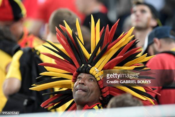 Belgium supporter reacts at the end the Russia 2018 World Cup semi-final football match between France and Belgium at the Saint Petersburg Stadium in...