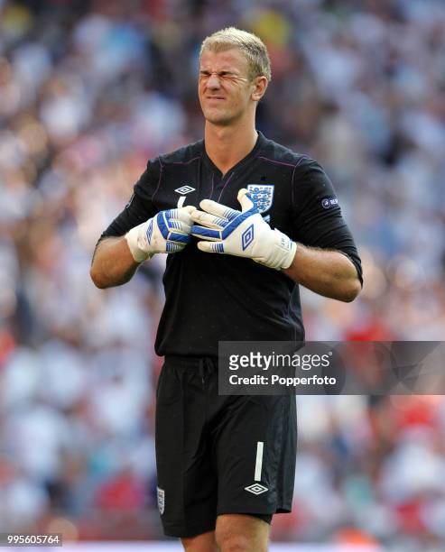 England goalkeeper Joe Hart reacts after the final whistle of the UEFA EURO 2012 group G qualifying match between England and Switzerland at Wembley...