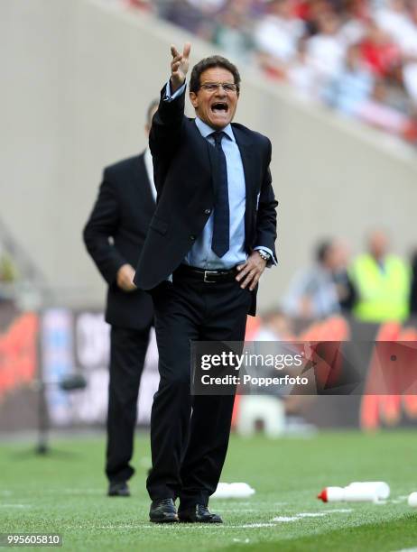 England manager and head coach Fabio Capello shouts from the touchline during the UEFA EURO 2012 group G qualifying match between England and...