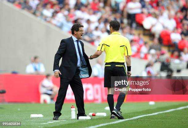 England manager and head coach Fabio Capello shouts at the assistant referee during the UEFA EURO 2012 group G qualifying match between England and...