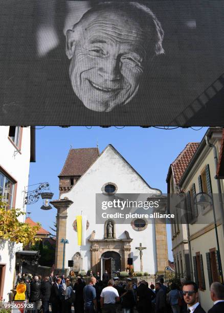 Photo of Heiner Geissler is shown on a video wall during the memorial service for the former CDU secretary general and minister of social affairs in...