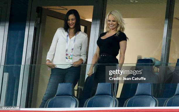 Pamela Anderson, girlfriend of Adil Rami of France celebrates with a friend the victory following the 2018 FIFA World Cup Russia Semi Final match...