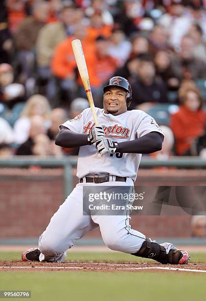 Carlos Lee of the Houston Astros drops to his knees to avoid being hit by a pitch during their game against the San Francisco Giants at AT&T Park on...