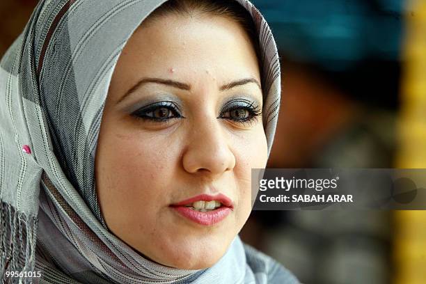 Iraqi Muslim student Marwa Abdel Karim is pictured at Baghdad University's faculty of languages in the Iraqi capital on May 10, 2010. Wearing an...