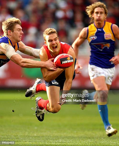 Brad Green of the Demons handballs during the round eight AFL match between the Melbourne Demons and the West Coast Eagles at Melbourne Cricket...