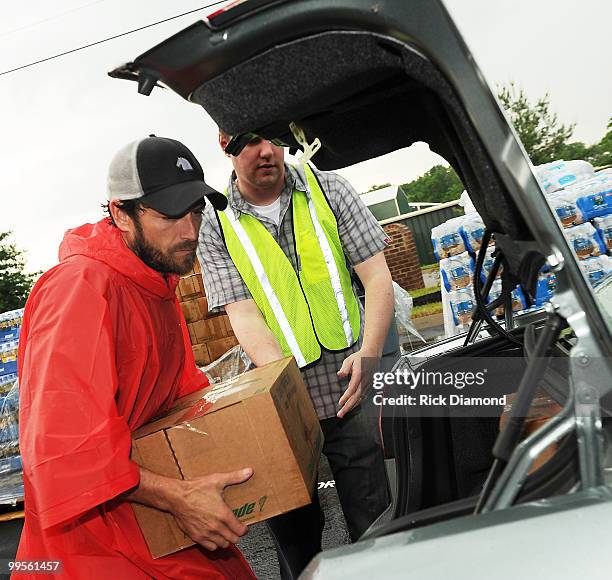 During lightening, hail and flash flood warnings Actor Luke Perry, part time Middle Tennessee resident volunteers with Soles4souls Inc.to bring...