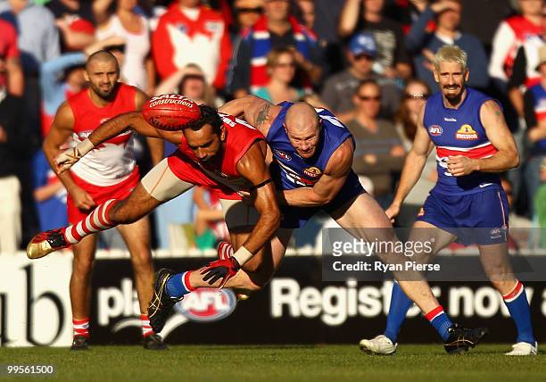 Barry Hall of the Bulldogs tackled Adam Goodes of the Swans during the round eight AFL match between the Western Bulldogs and the Sydney Swans at...