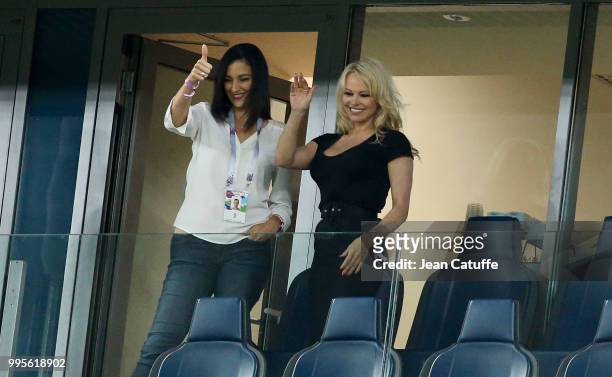 Pamela Anderson, girlfriend of Adil Rami of France celebrates with a friend the victory following the 2018 FIFA World Cup Russia Semi Final match...