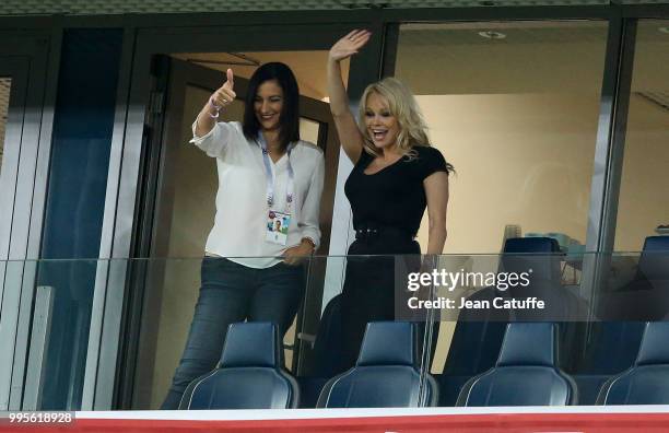 Pamela Anderson, girlfriend of Adil Rami of France celebrates with a friend the victory following the 2018 FIFA World Cup Russia Semi Final match...