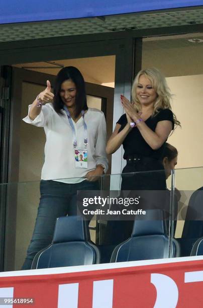 Pamela Anderson, girlfriend of Adil Rami of France celebrates with a friend the victory following the 2018 FIFA World Cup Russia Semi Final match...