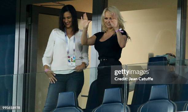 Pamela Anderson, girlfriend of Adil Rami of France celebrates with a friend the victory following the 2018 FIFA World Cup Russia Semi Final match...