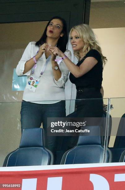 Pamela Anderson, girlfriend of Adil Rami of France celebrates with a friend the victory following the 2018 FIFA World Cup Russia Semi Final match...