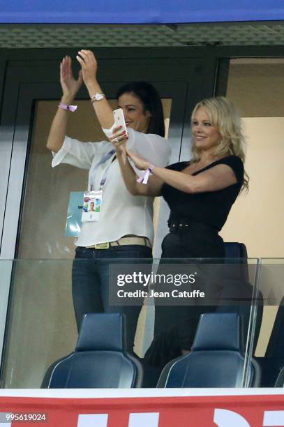 Pamela Anderson, girlfriend of Adil Rami of France celebrates with a friend the victory following the 2018 FIFA World Cup Russia Semi Final match...