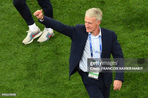 France's coach Didier Deschamps celebrates at the end of the Russia 2018 World Cup semi-final football match between France and Belgium at the Saint...