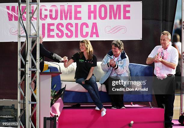 Teen sailor Jessica Watson is congratulated by Prime Minister Kevin Rudd, as mother Julie and father Roger look, on following her world record...