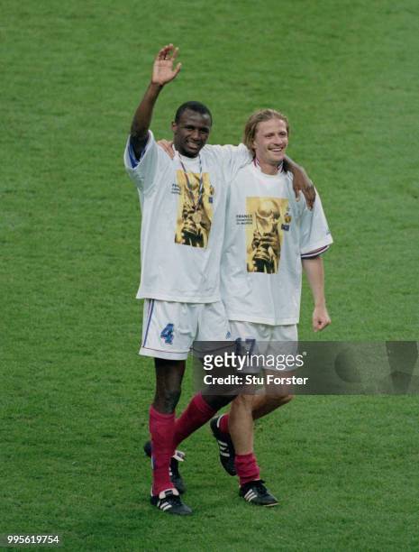 Arsenal duo Patrick Viera and Emmanuel Petit celebrate after France win the 1998 FIFA World Cup Final against Brazil at Stade de France on July 12,...