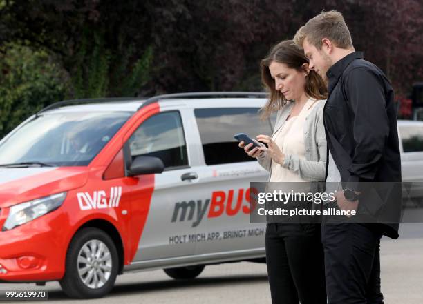 Two clients order a 'myBUS' mini van at the depot of the Duisburg Public Transport Company in Duisburg, Germany, 27 September 2017. The mini van does...