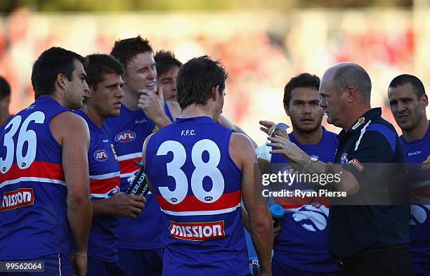 Rodney Eade, coach of the Bulldogs, speaks to his players during the round eight AFL match between the Western Bulldogs and the Sydney Swans at...