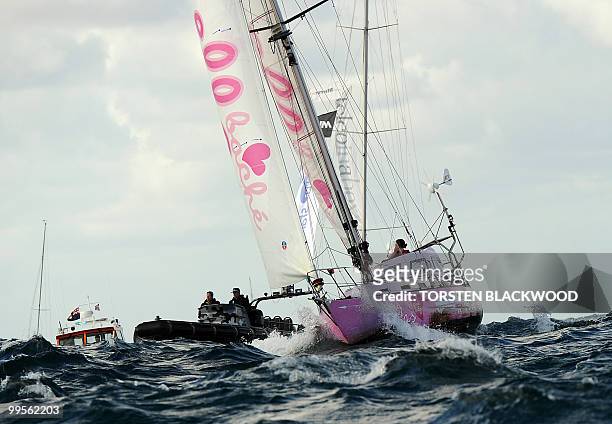 Australian round-the-world sailor, Jessica Watson, sails her yacht 'Ella's Pink Lady' across the official finish line at the entrance to Sydney...