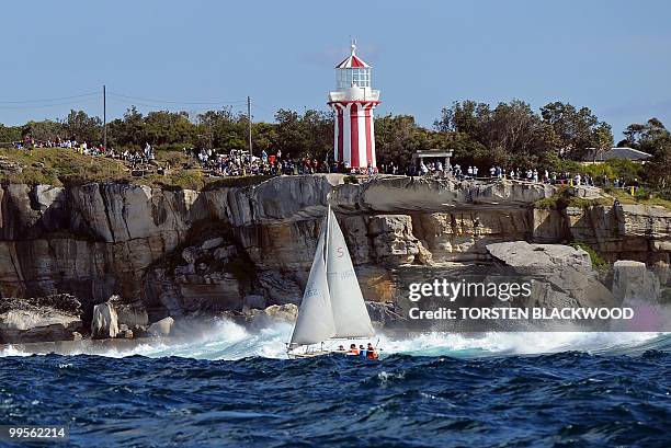 Spectators line the cliffs at South Head to watch Australian round-the-world sailor, Jessica Watson, sail her yacht 'Ella's Pink Lady' across the...