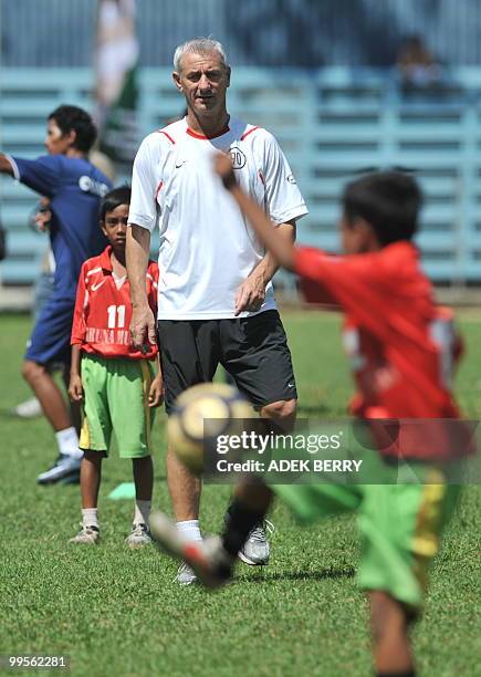 Liverpool football legend Ian Rush attends a children's coaching clinic in Jakarta on May 15, 2010. Rush took part in a series of sports activities...