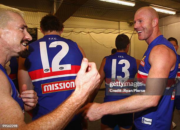 Barry Hall and Jason Akermanis of the Bulldogs celebrate after the round eight AFL match between the Western Bulldogs and the Sydney Swans at Manuka...
