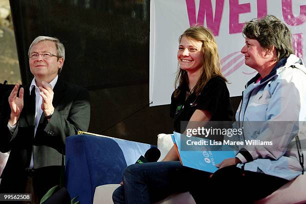 Prime Minister Kevin Rudd joins teen sailor Jessica Watson and Julie Watson on stage after Jessica arrived home in Sydney following her world record...